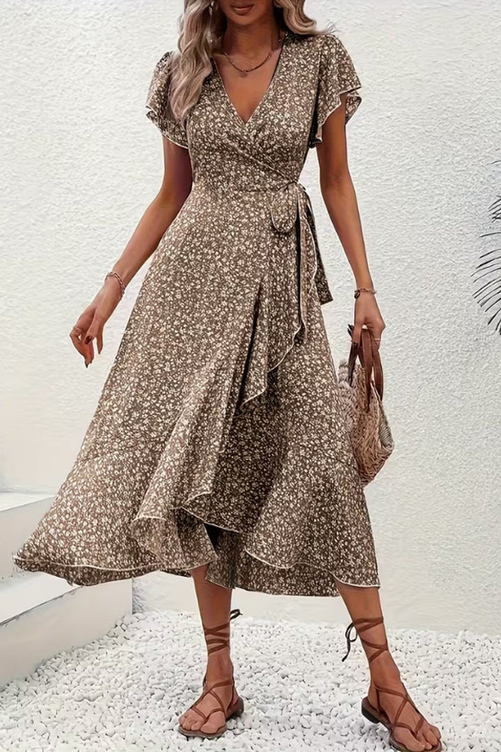 Chic floral wrap midi dress for women, featuring a flattering V-neck and delicate flutter sleeves.