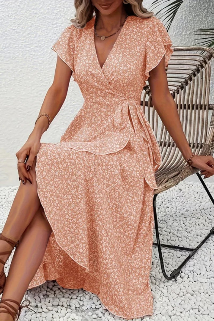Versatile floral V-neck midi wrap dress with flutter sleeves, perfect for day or evening.