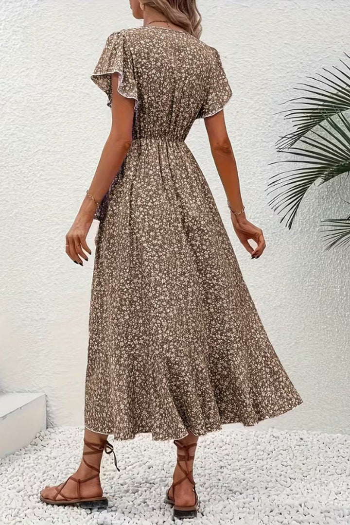 Boho floral midi wrap dress with an asymmetric hem, perfect for summer parties or wedding guests.