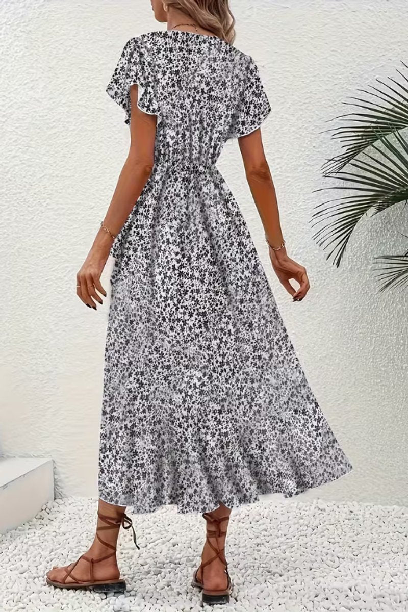 Party-ready floral print wrap dress, a stylish midi length with a sophisticated V-neck.