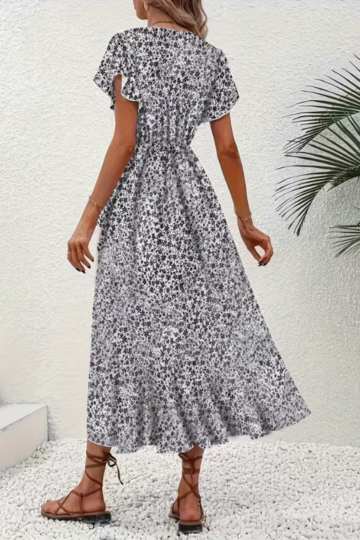 Party-ready floral print wrap dress, a stylish midi length with a sophisticated V-neck.
