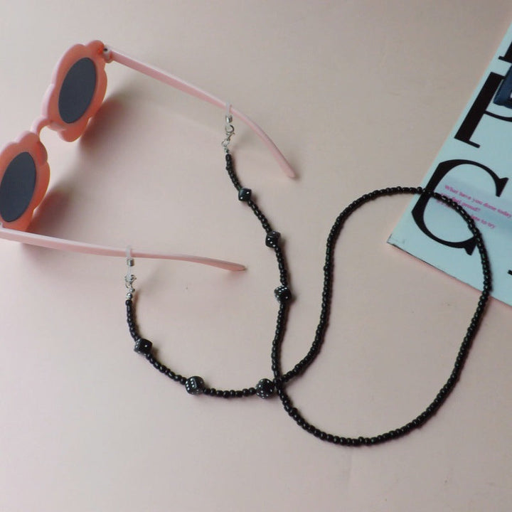 Lightweight women's flower sunglasses and beautiful beaded strap, providing stylish UV protection.