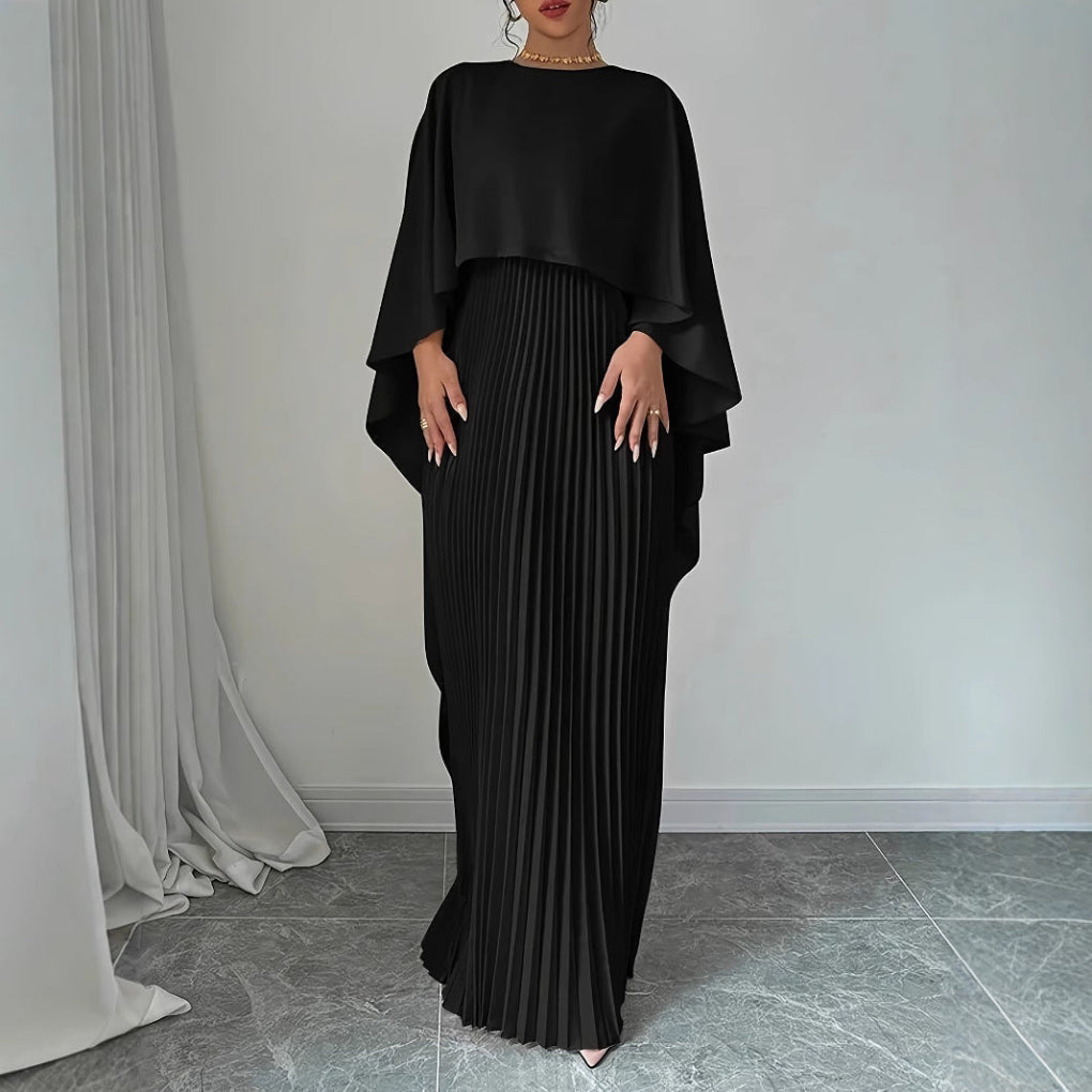 Flowy pleated batwing sleeve maxi dress for women. Elegant long autumn dress, ideal for special occasions.