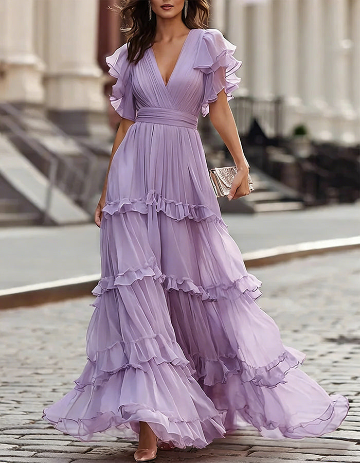 Flowing maxi dress for wedding guests, delicate ruffled hem, elegant and comfortable.