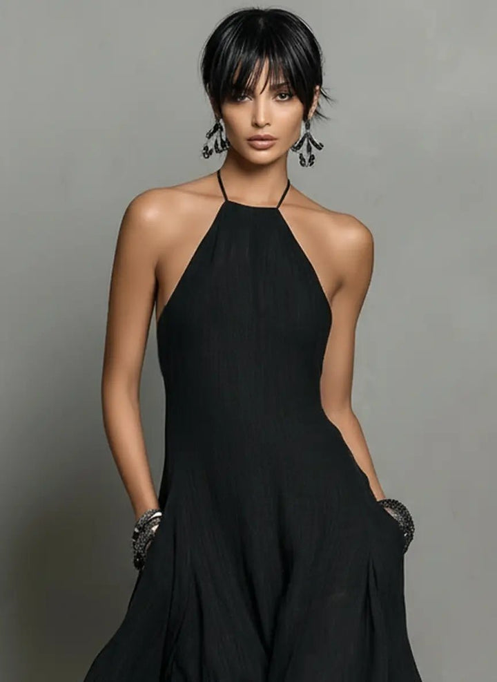Women's flowy maxi dress, halterneck and sleeveless design, great for elegant summer events & resort holidays.
