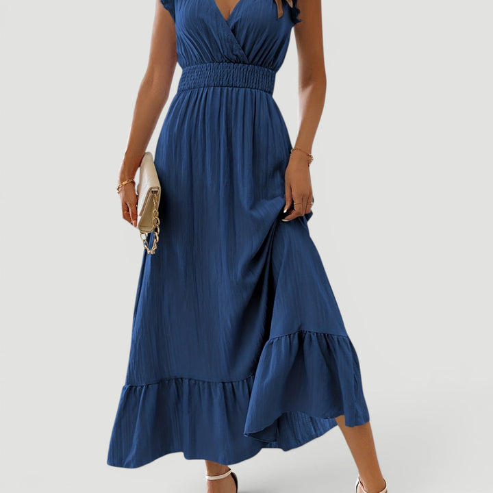 Women's long flowy V-neck maxi dress, a stunning choice for elegant summer evenings & special occasions.