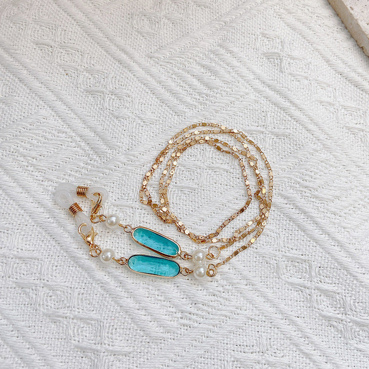 Sophisticated women's pearl and gemstone pendant necklace, shimmering elegant jewelry gift.