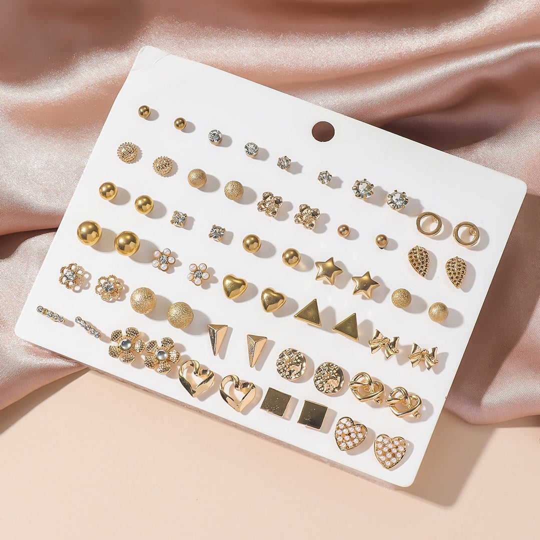 Elegant gold-toned women's earring set featuring delicate rhinestone details. Versatile fashion accessory.