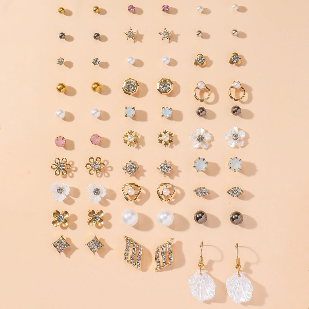 Chic women's gold jewelry set, elegant earrings with sparkling rhinestone details. A versatile fashion accessory.