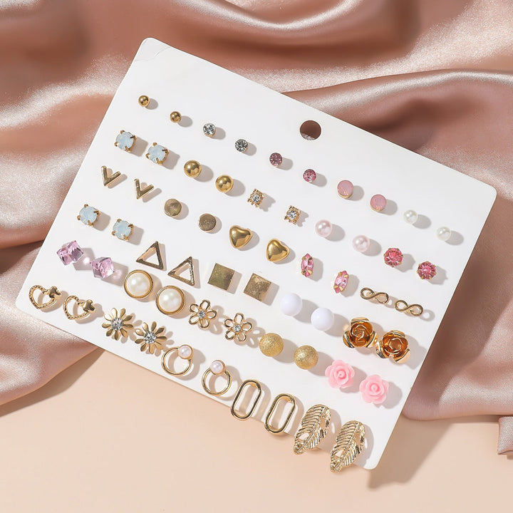 Trendy women's gold earring set, a versatile fashion accessory featuring shimmering rhinestones.
