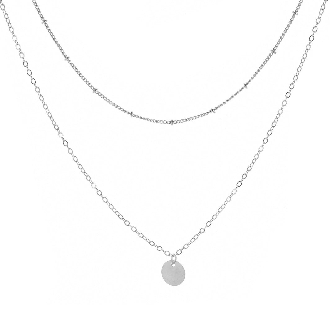 Refined women's gold layered chain necklace. Elegant, sophisticated jewelry, perfect for a subtle yet impactful look.