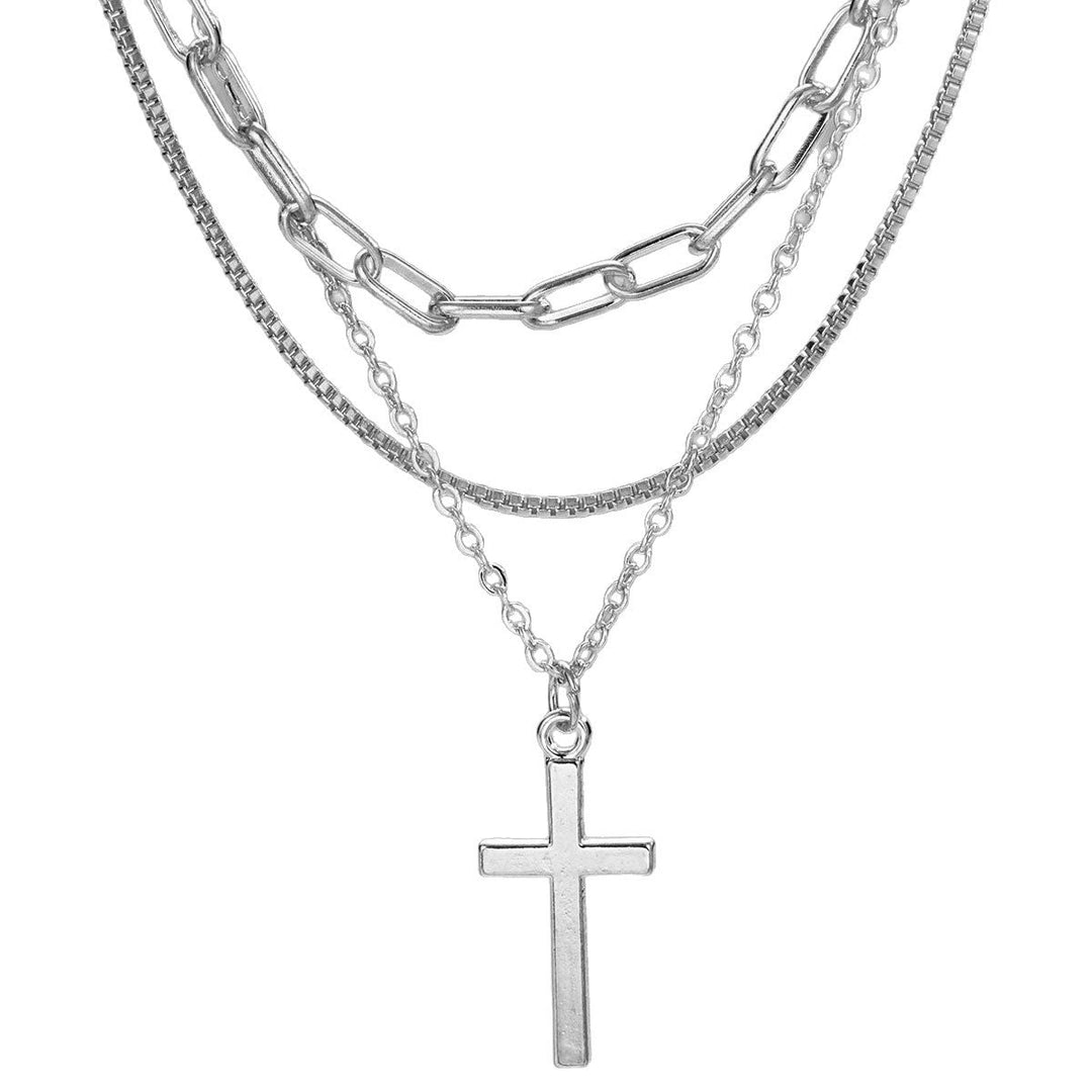 Woman wearing a beautiful gold multi-layered necklace with an elegant cross pendant. Spiritual fashion statement.