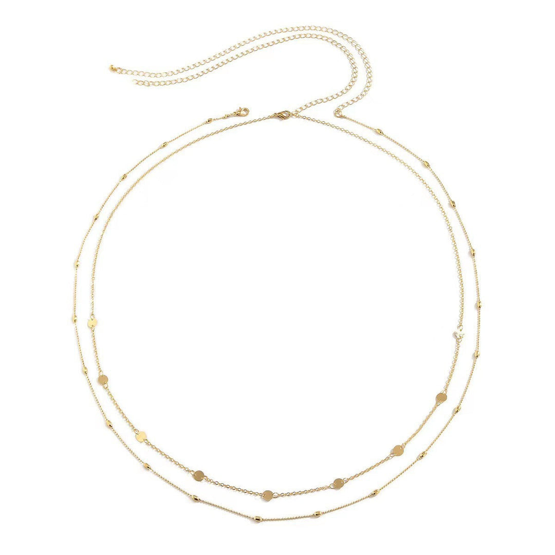 Everyday elegant women's layered gold necklace with various delicate charm pendants.