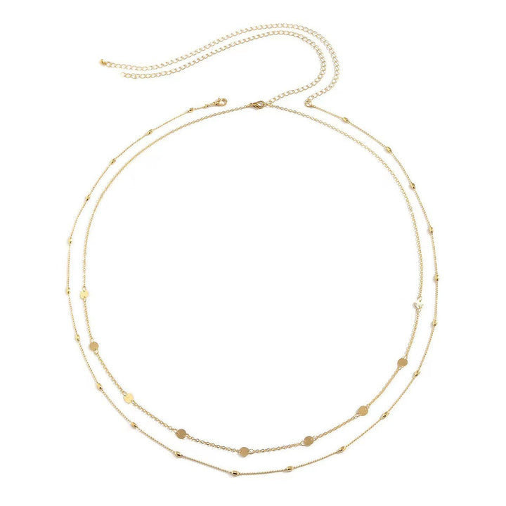Everyday elegant women's layered gold necklace with various delicate charm pendants.