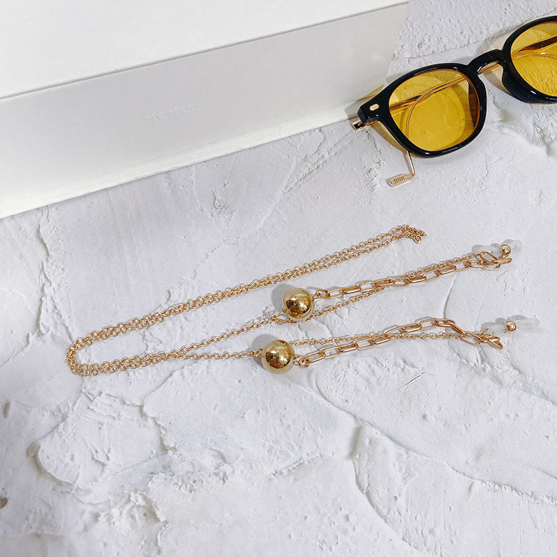 Modern gold-tone pendant necklace, an elegant women's accessory for a chic look and fashionable daily wear.