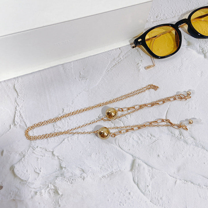 Modern gold-tone pendant necklace, an elegant women's accessory for a chic look and fashionable daily wear.