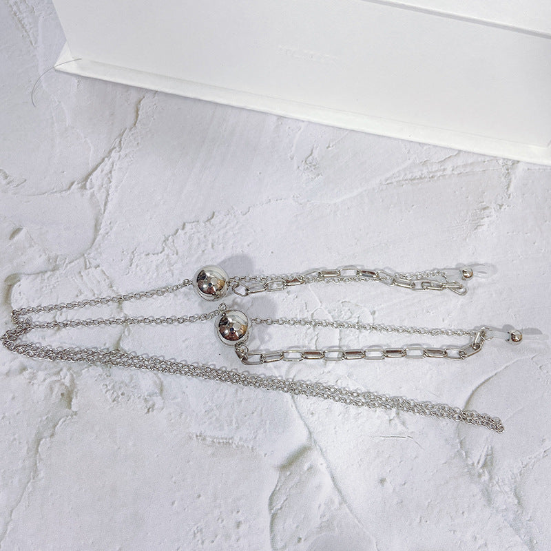 Close-up of an elegant gold-tone pendant necklace, a chic women's jewelry accessory with modern design.