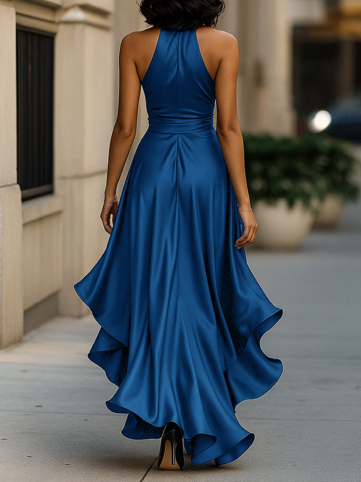 Women's flowing halter ruffle high-low evening gown in motion, elegant and chic design.