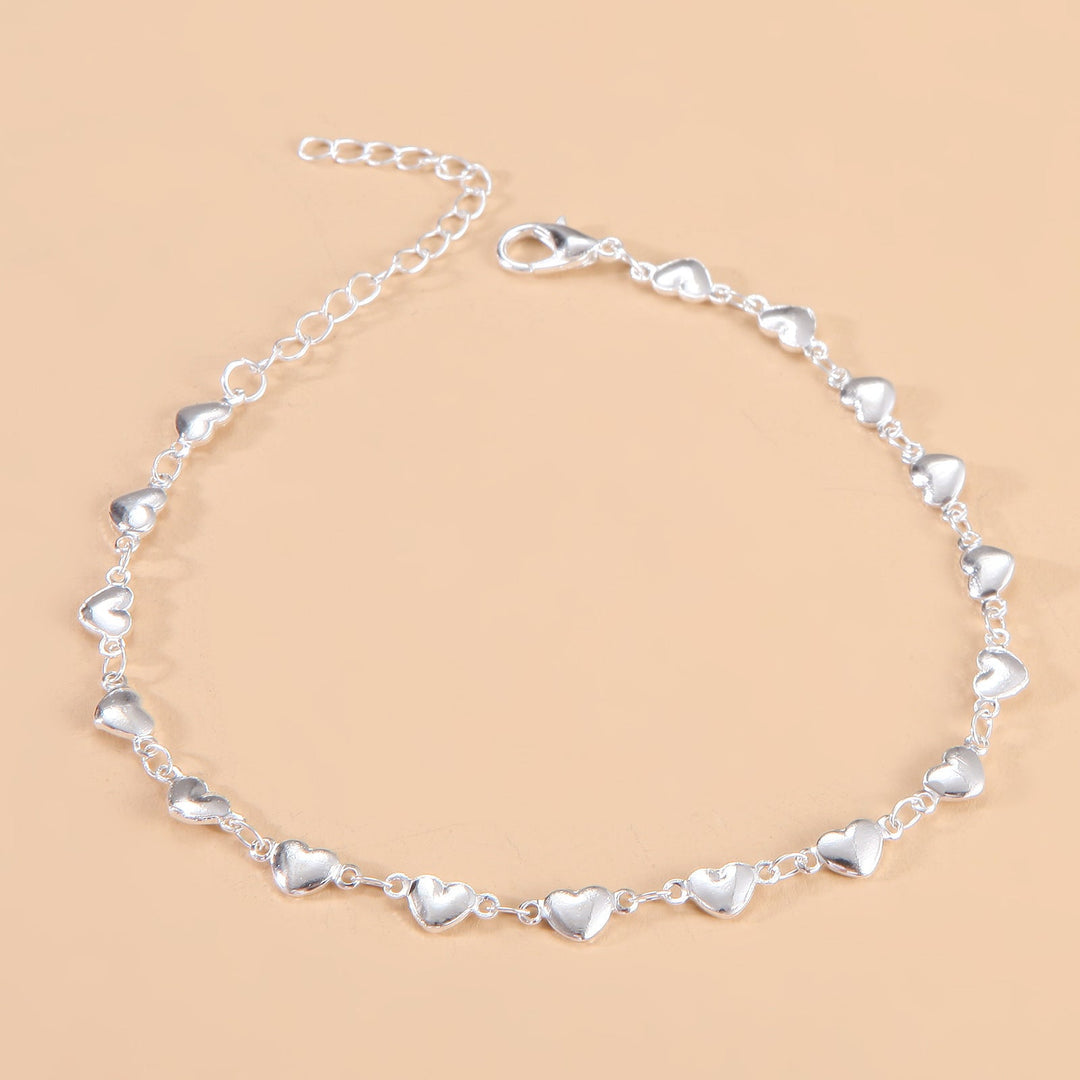 Adjustable women's chain anklet with heart charm, comfortable and stylish summer foot jewelry.