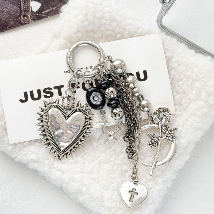 Detailed women's floral heart motif charm keychain, a chic and charming accessory.