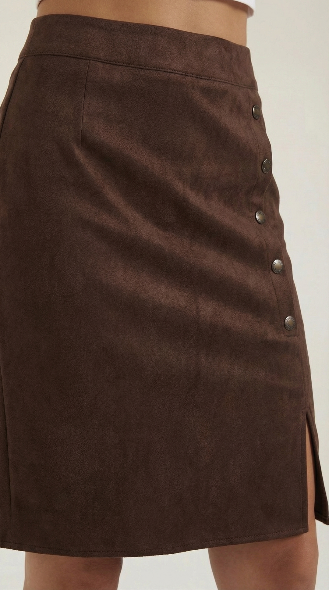 Stylish casual high-waisted mini skirt for women, with prominent front button accents.