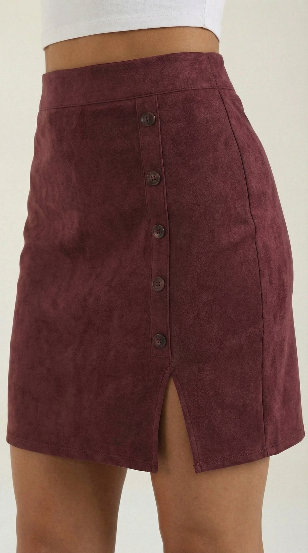 Trendy high-waisted mini skirt for women, with eye-catching button detailing for a chic style.