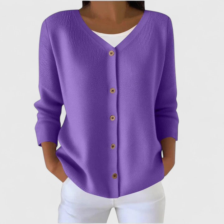 Cozy knit hooded cardigan for women, showing elegant button detail and soft texture.