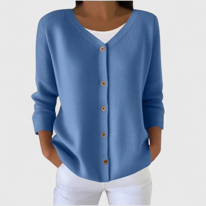 Model wearing an elegant women's hooded button-down cardigan, ideal for versatile layering.