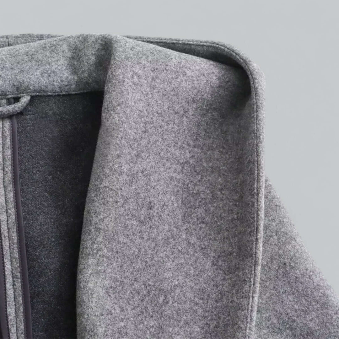 Modern women's hooded long trench coat, combining comfort with high-fashion outerwear.
