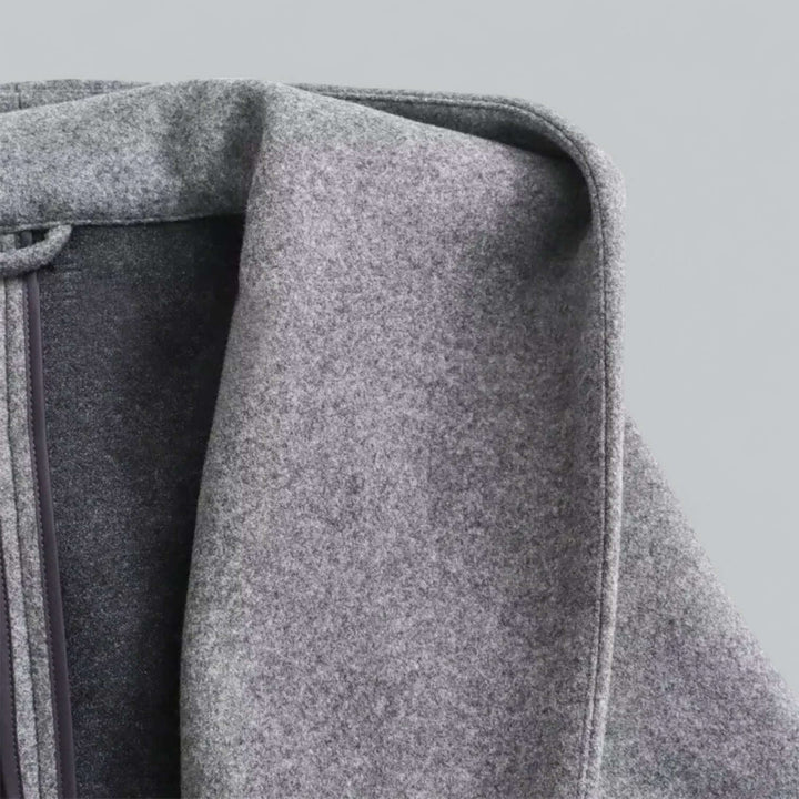 Modern women's hooded long trench coat, combining comfort with high-fashion outerwear.