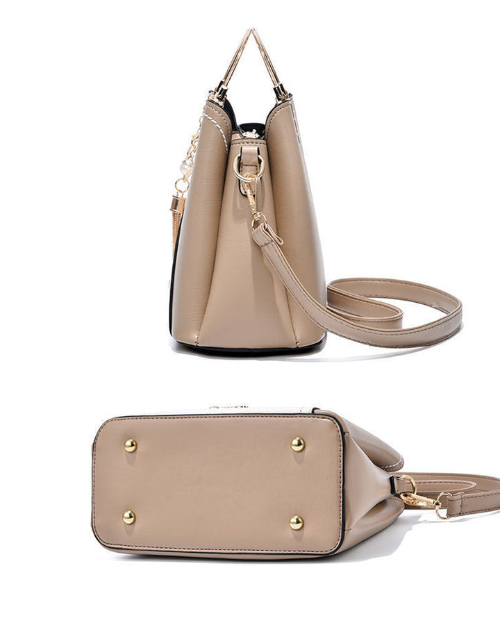 Women's spacious PU leather tote bag, ideal for daily use, with adjustable strap.