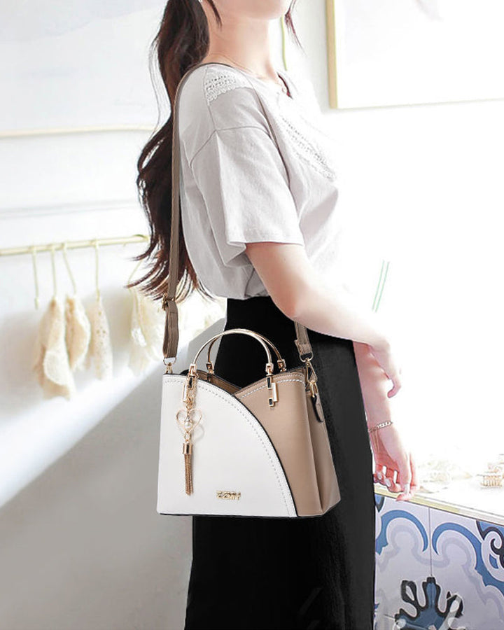 Smart women's PU leather handbag, large capacity and versatile with an adjustable strap.