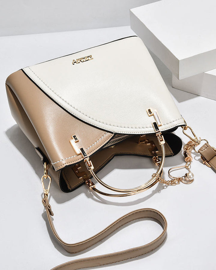 Large PU leather women's handbag, perfect for work or travel, adjustable strap.