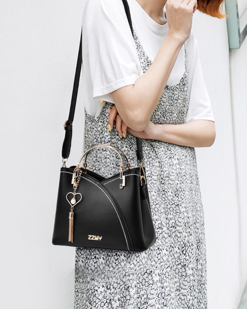 Elegant women's PU leather crossbody tote, large capacity, with adjustable strap.
