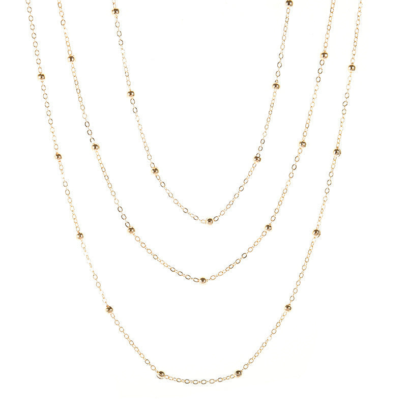 Multi-layered beaded chain necklace for women, a chic and versatile jewelry accessory.