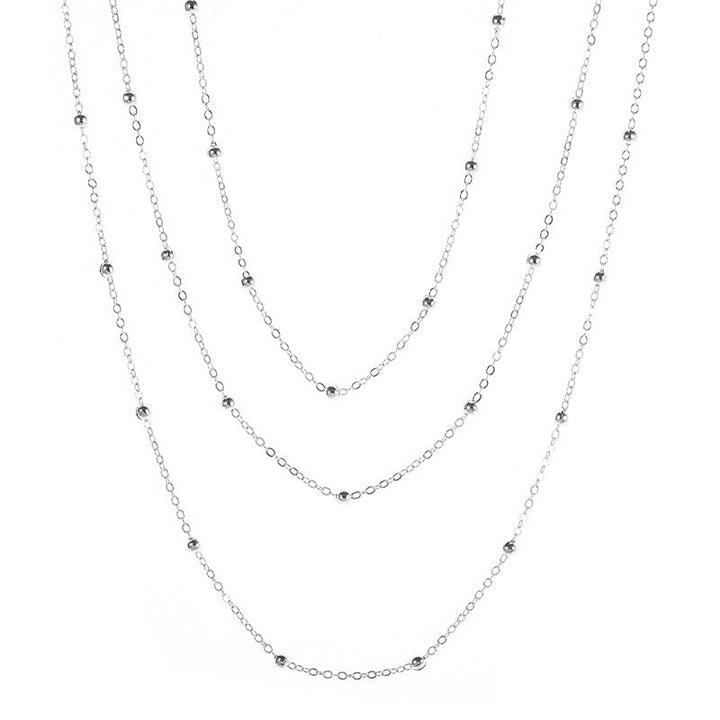 Fashionable women's layered necklace with multiple beaded chains, an elegant jewelry accessory.