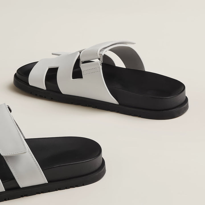Front view of women's chic strap sandals, emphasizing their clean lines and comfortable fit.