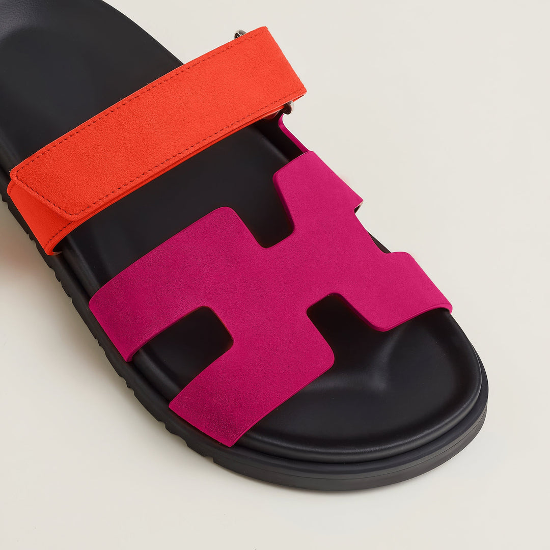 Close-up on the adjustable buckle of the elegant women's leather strap sandals for a custom fit.