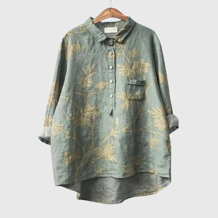Lightweight women's blouse, elegant floral pattern, long sleeve, round neck for sophisticated look.