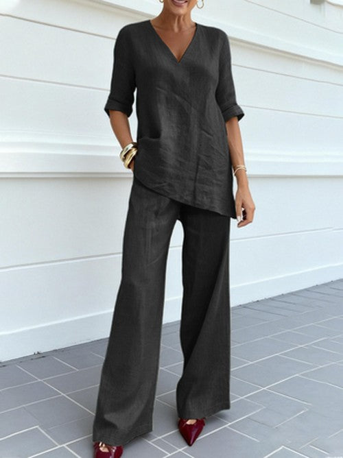 Spring fashion women's linen two-piece outfit with an elegant V-neck top and wide-leg pants for a chic look.
