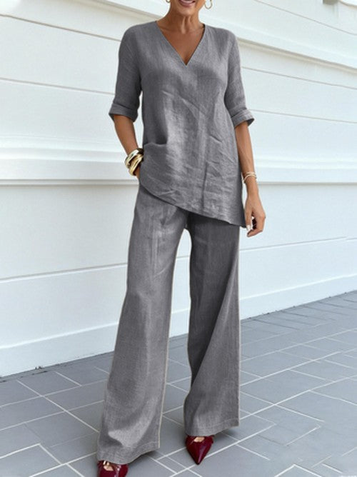 Casual women's linen two-piece set, ideal for summer, featuring a V-neck top and flowy wide-leg pants.