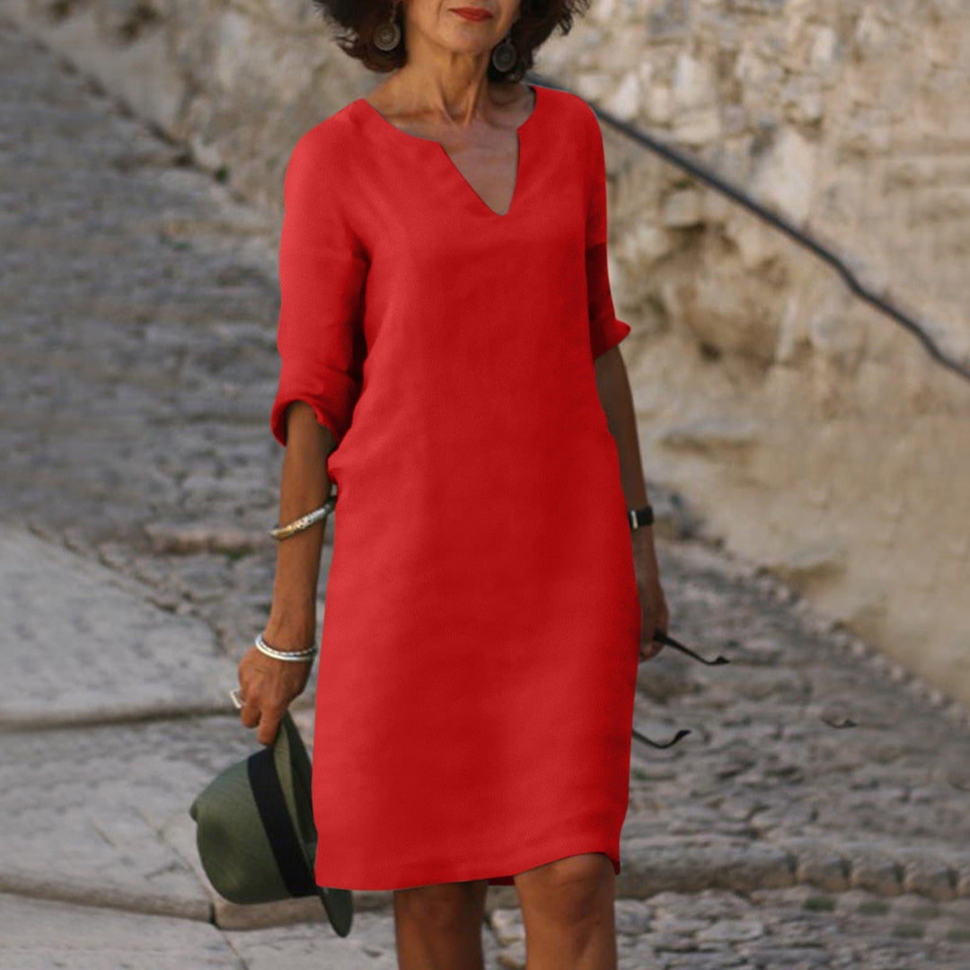Women's elegant linen V-neck summer dress, comfortable and fresh for versatile warm-weather fashion.