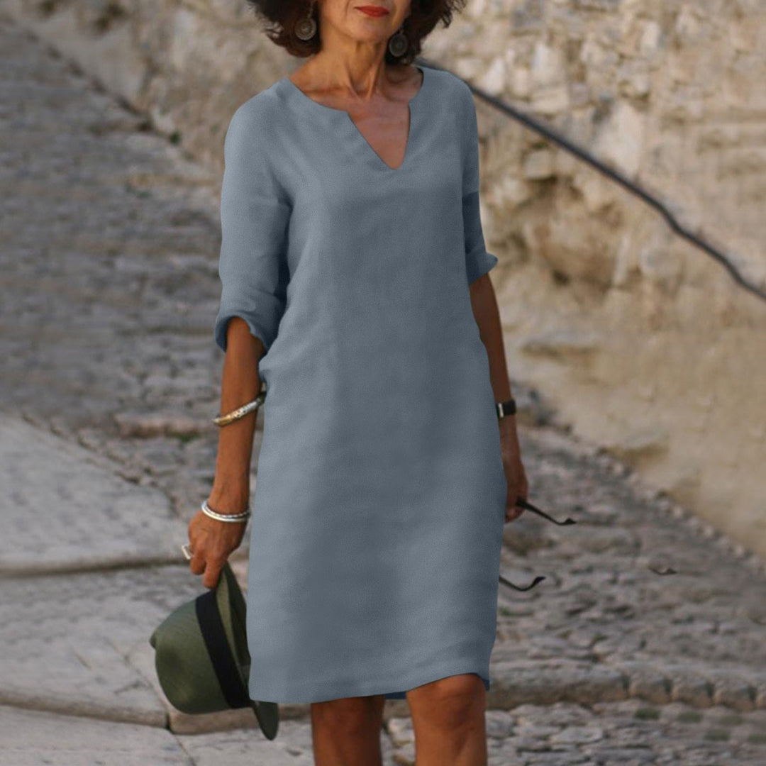Elegant women's linen summer dress, comfortable and fresh with V-neck, ideal for warm-weather apparel.