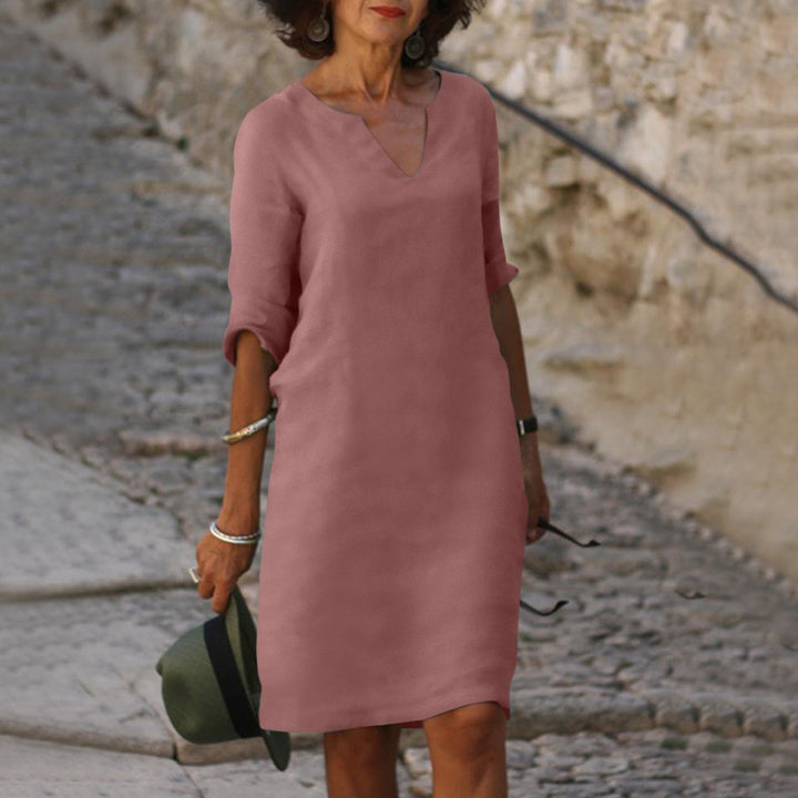 Elegant women's comfortable linen dress, V-neck design, ideal for versatile summer casual wear.