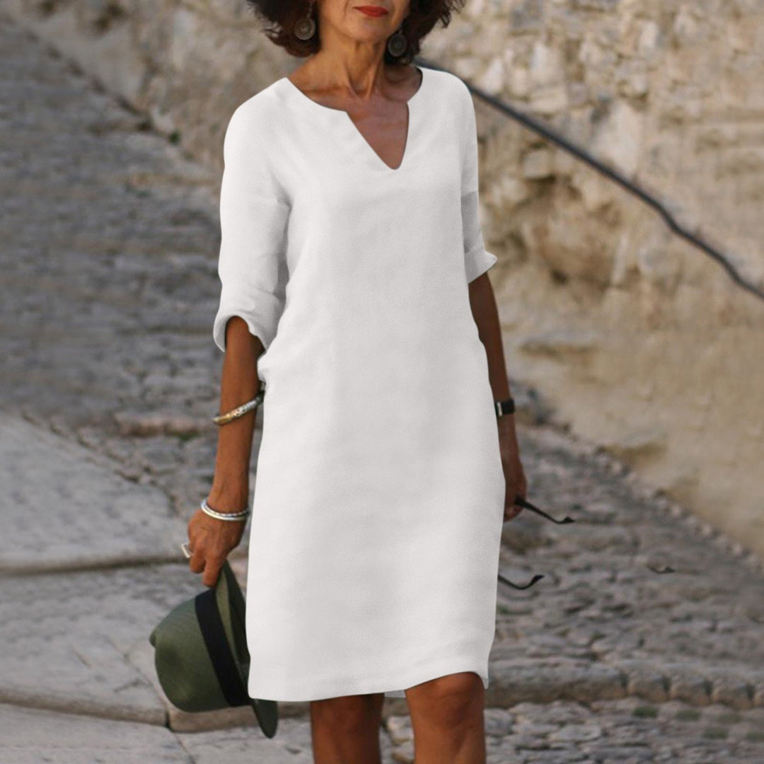 Comfortable linen V-neck dress for women, elegant summer apparel, great for versatile warm-weather style.