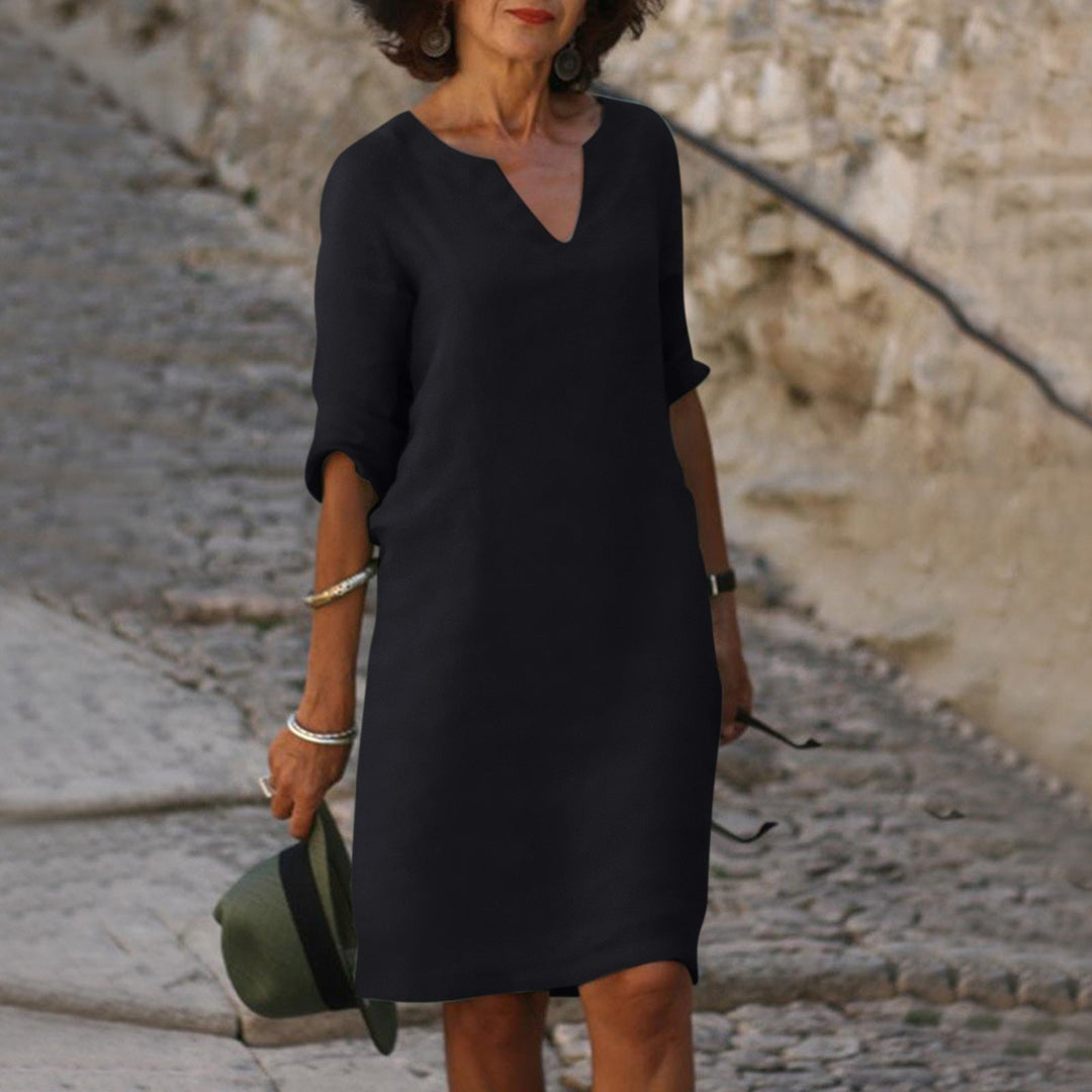Chic women's summer dress, elegant linen V-neck, provides ultimate comfort for warm-weather fashion.