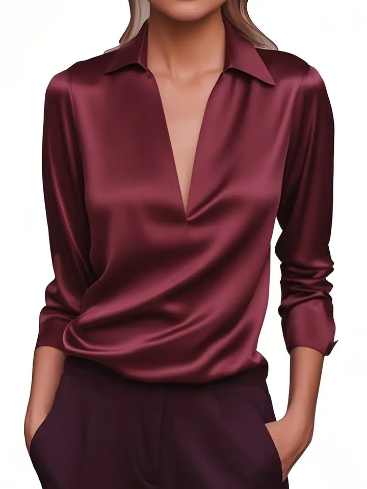 Navy women's long sleeve V-neck collared top, professional and elegant workwear.