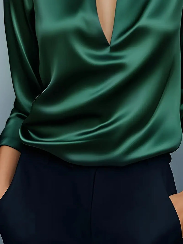 Blue women's long sleeve collared V-neck blouse, perfect for professional settings.