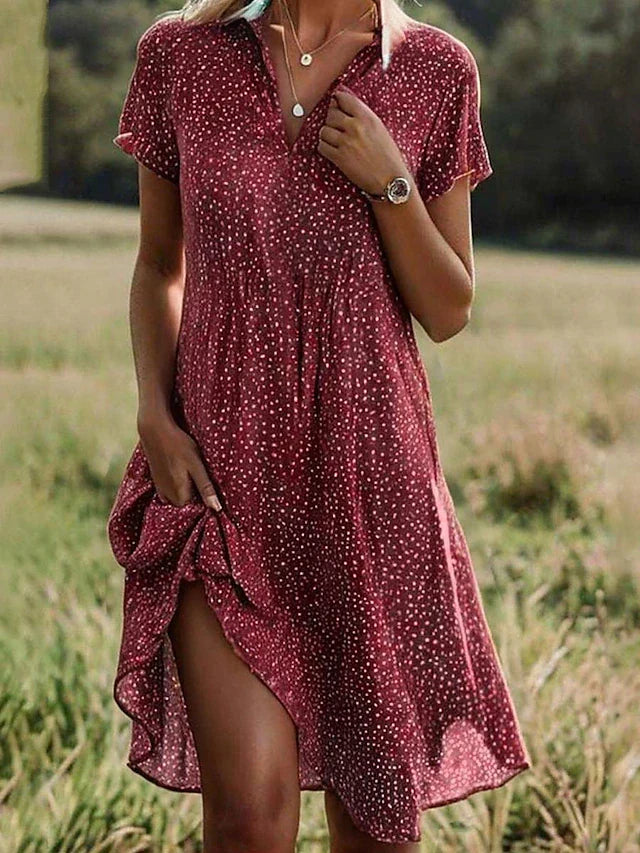 Versatile women's midi shirt dress, button-down style with short sleeves, ideal for casual or elegant day wear.