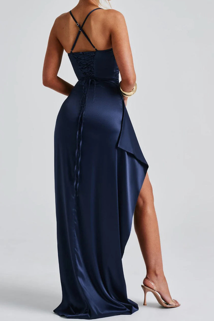 Elegant women's navy blue maxi dress, ruched detailing, high leg slit, and spaghetti straps for special occasions.